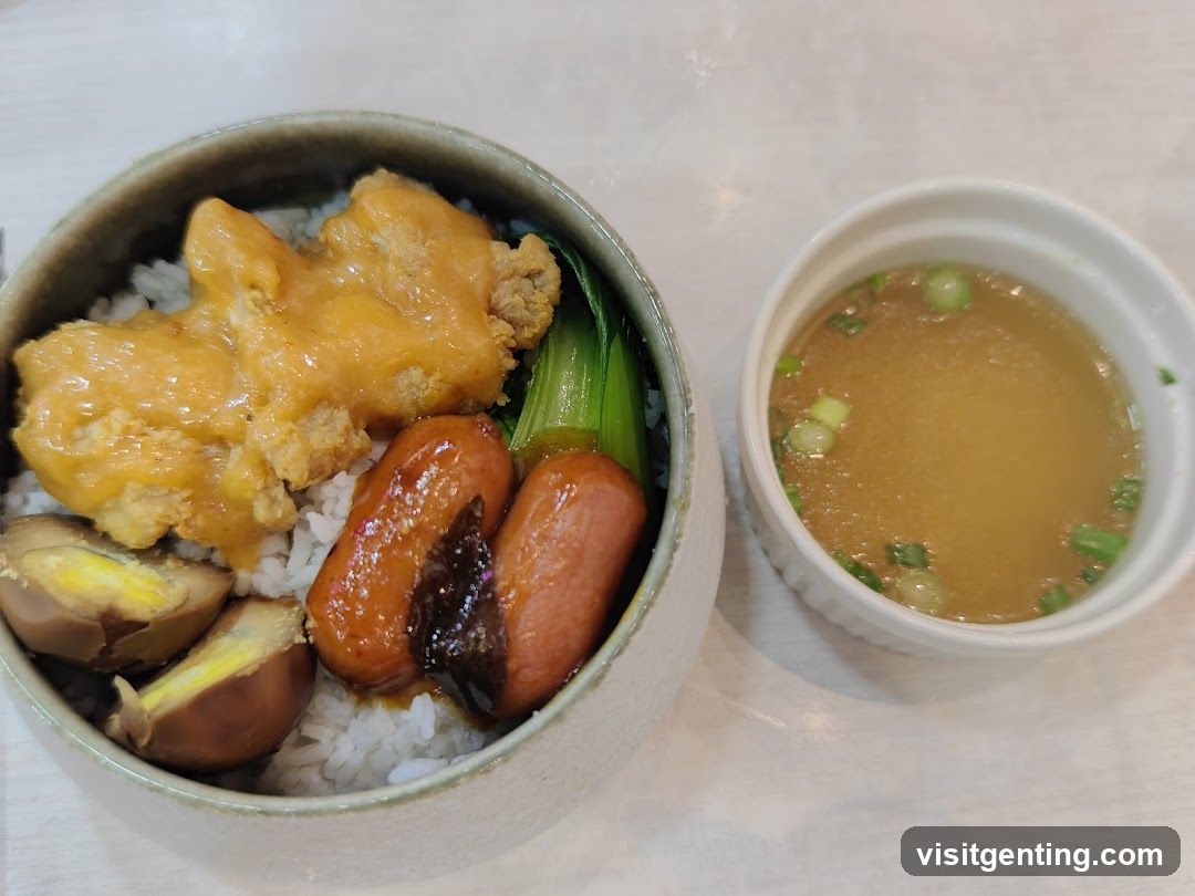 Meal served in bowl with side soup