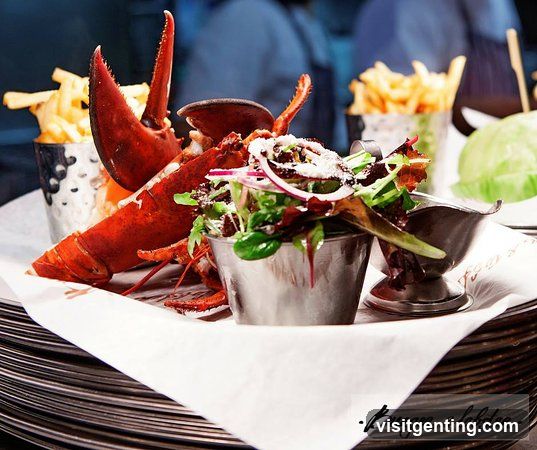 Lobster dish served with salad and fries