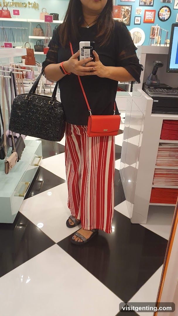 Woman holding handbags in a store