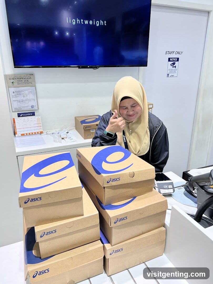 Staff with Asics Shoe Boxes
