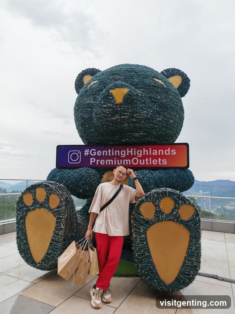 Man Posing with Giant Teddy Bear Sculpture