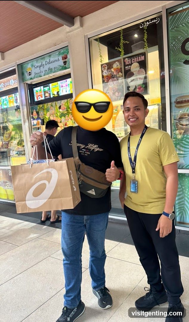 Two men posing in front of a food stall