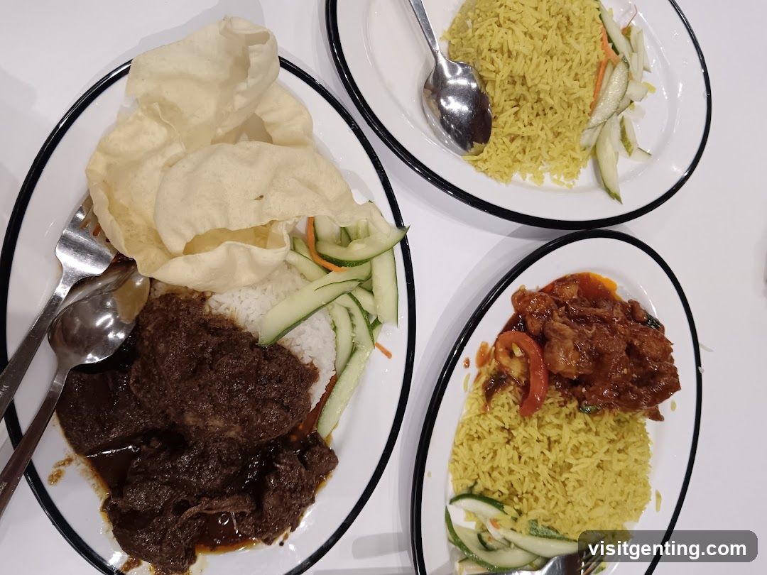 Three plates of rice with meat and vegetables