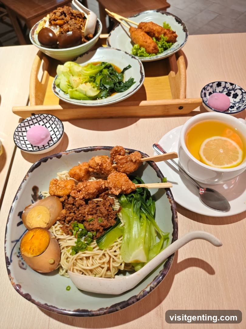 Noodle Dish with Sides and Tea
