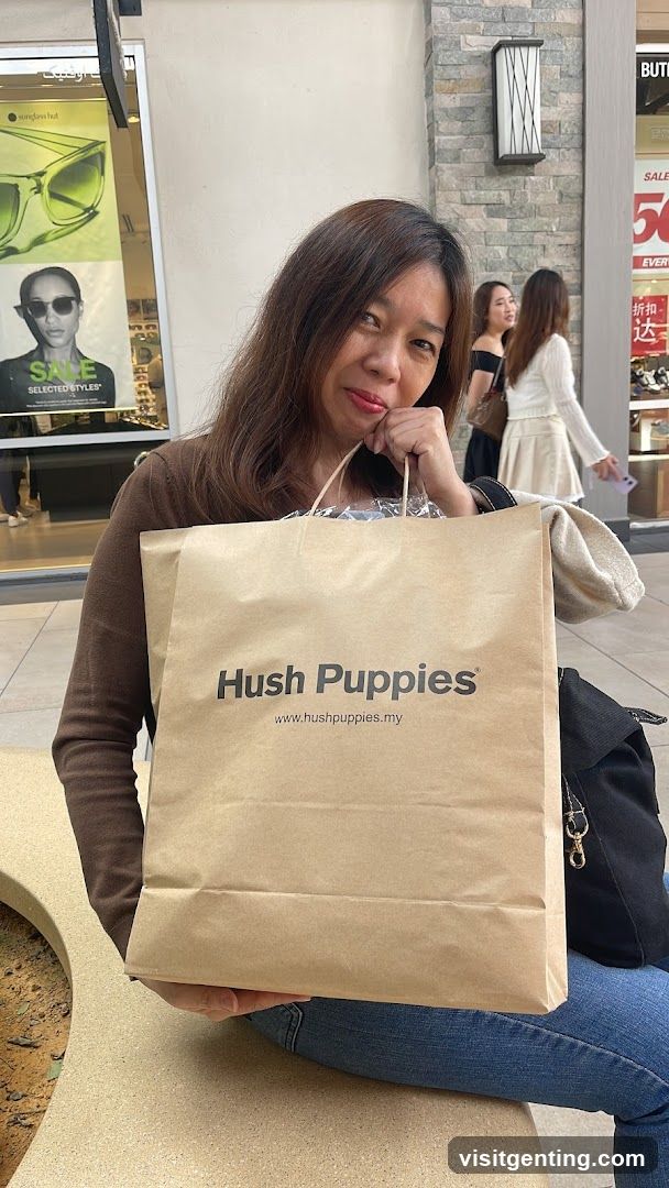 Woman with Hush Puppies shopping bag