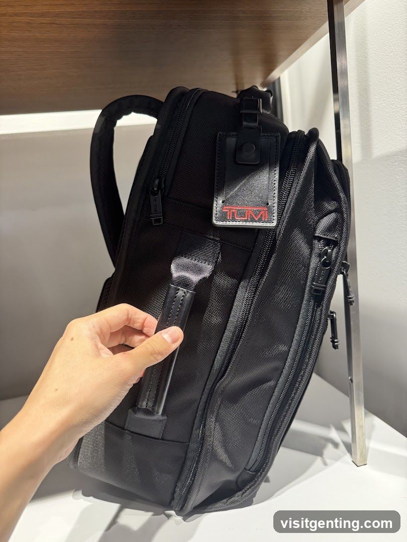 Black Backpack with Tumi Tag