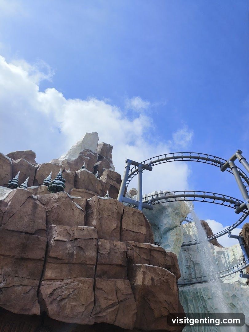 Roller Coaster with Mountain and Waterfall Scenery