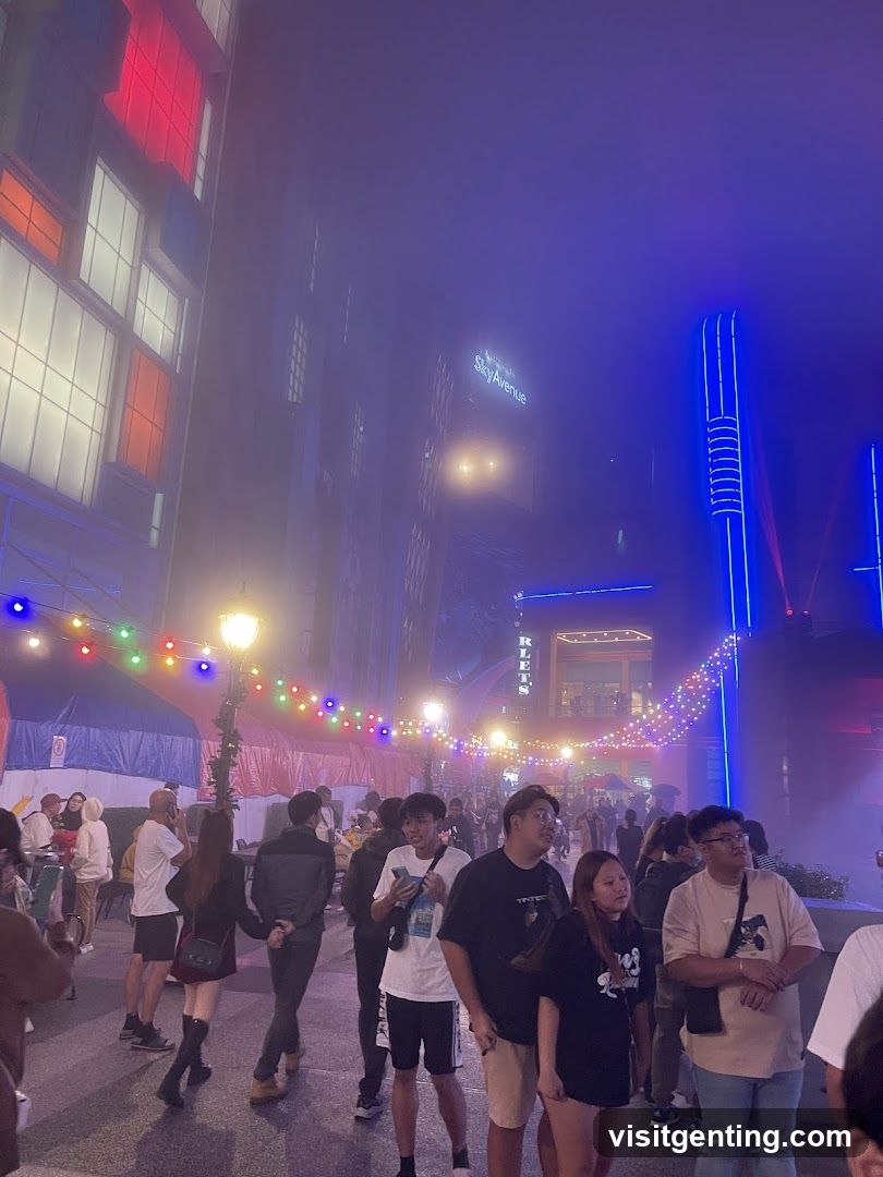Nighttime street scene with crowds and illuminated buildings