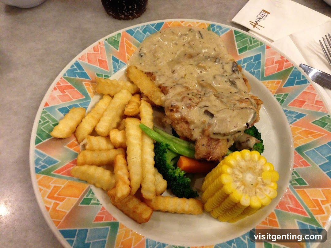 Chicken dish with fries and vegetables