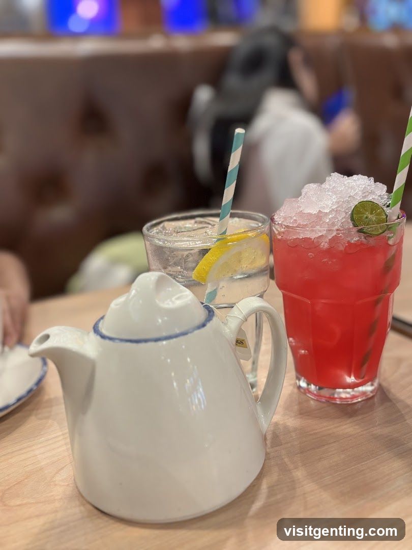 Teapot and drinks on table