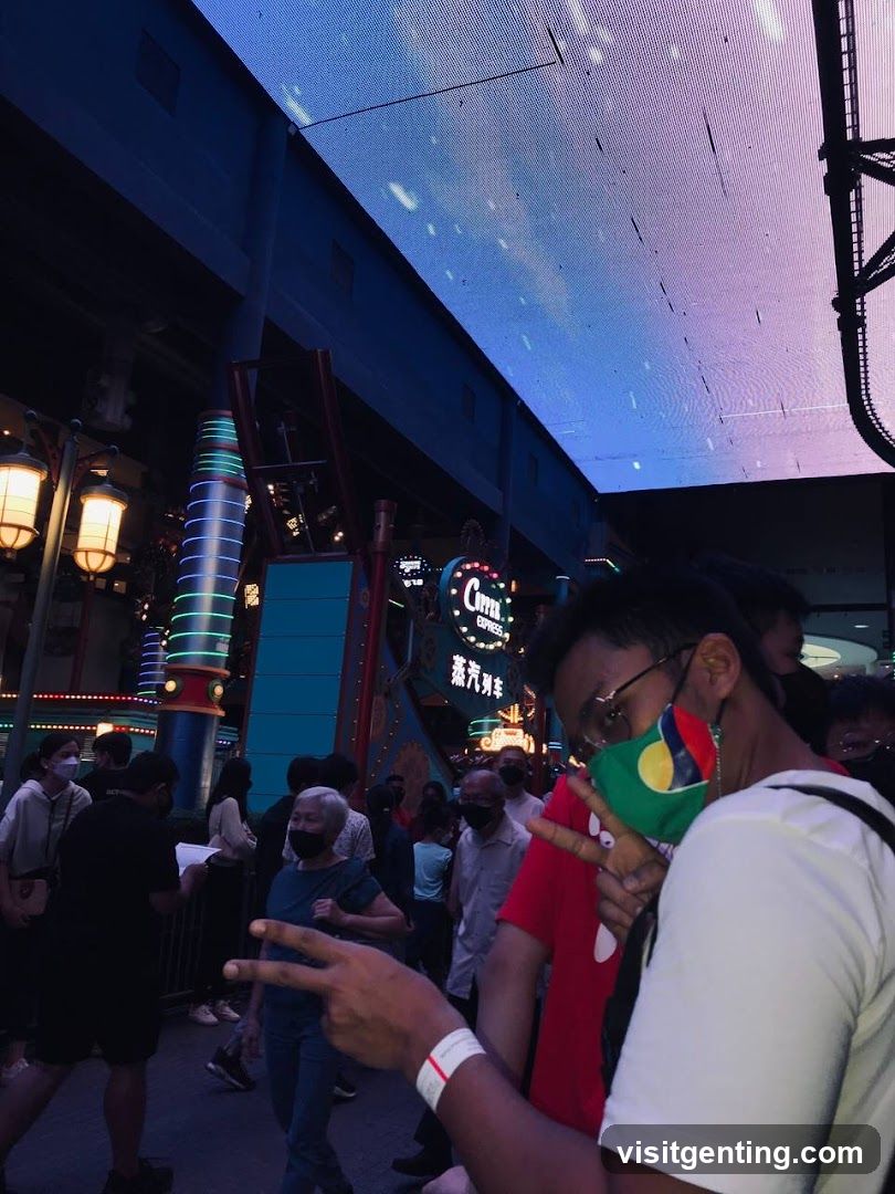 People in a lively outdoor entertainment area at night
