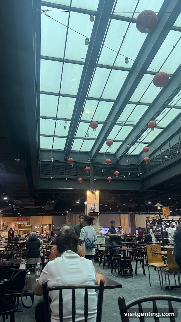 Indoor dining area with glass ceiling and hanging lanterns