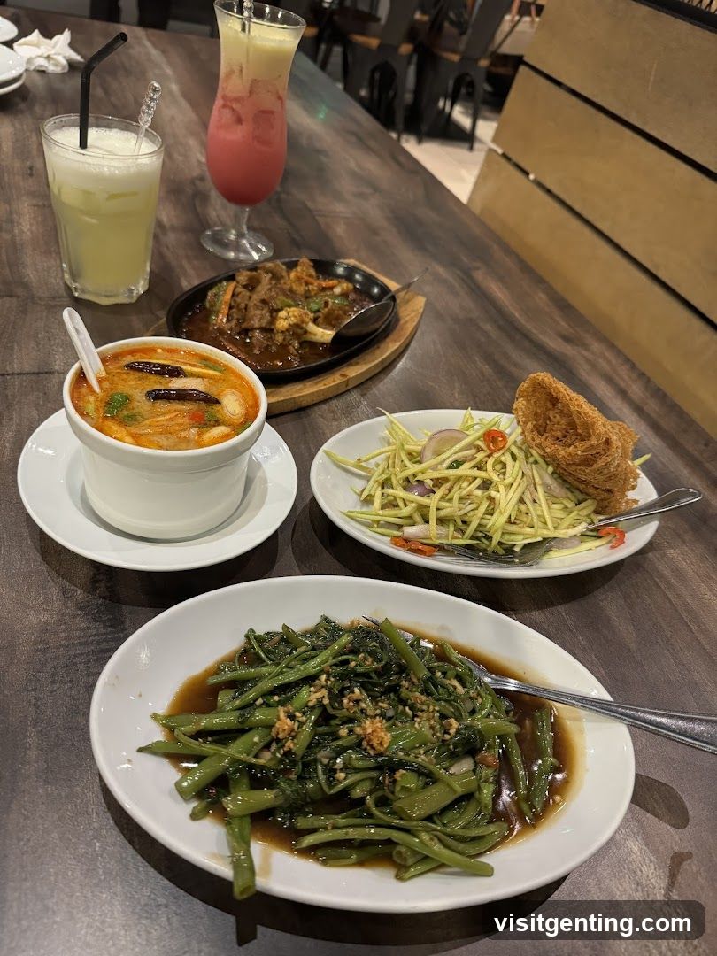 Table with Thai dishes and drinks