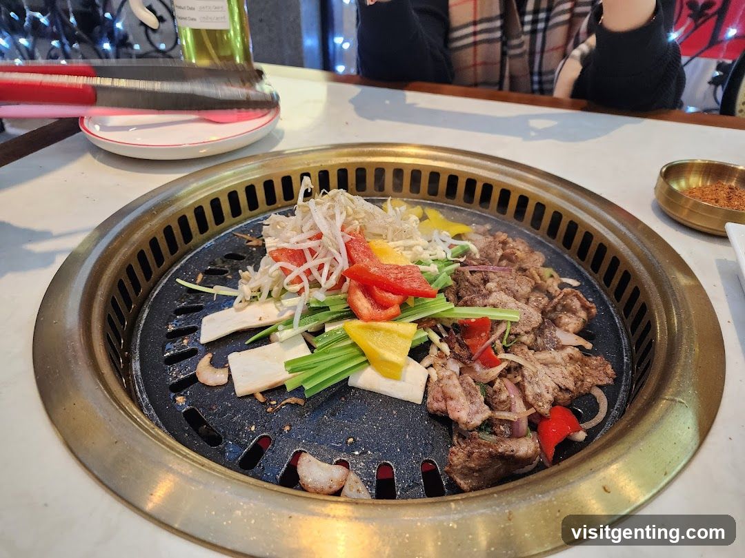 Grilled meat and vegetables on a Korean BBQ grill