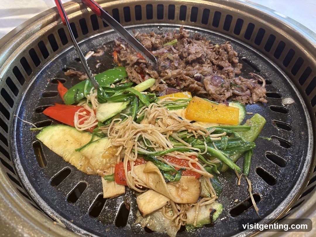 Grilled meat and vegetables on a Korean BBQ grill