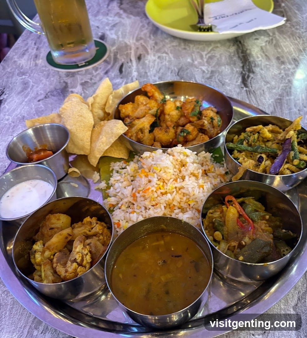 Indian meal served on metal tray