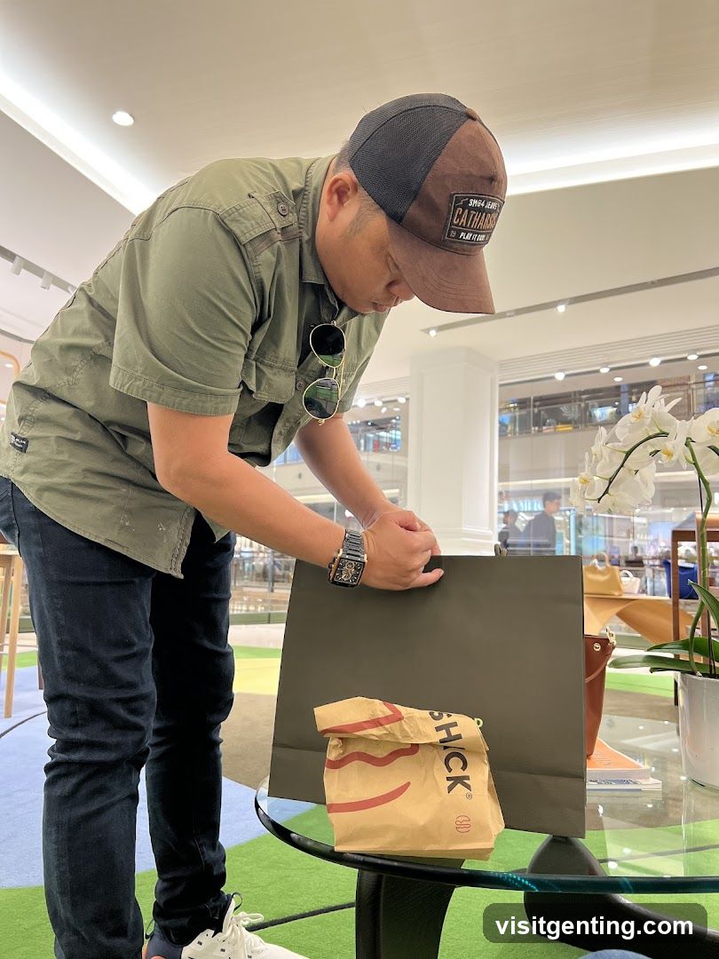 Man with shopping bags in mall