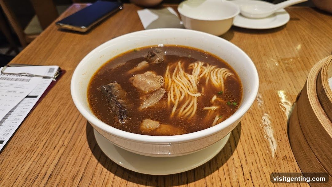 Bowl of Noodle Soup on Wooden Table