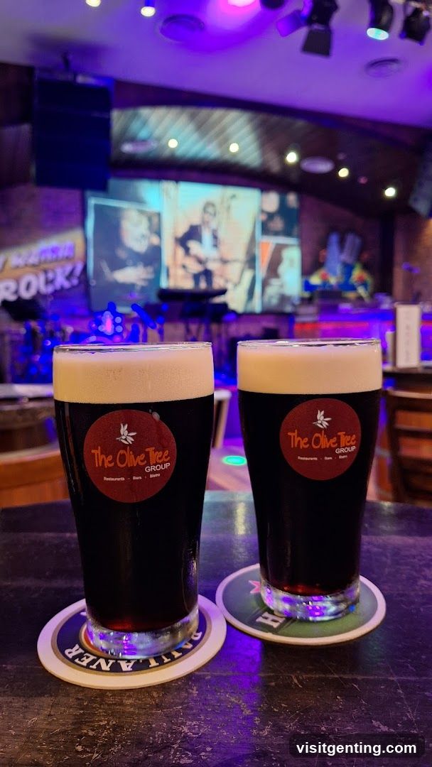 Two beer glasses at a bar