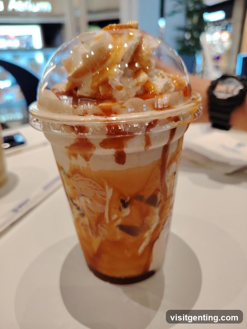 Caramel-drizzled beverage with whipped cream