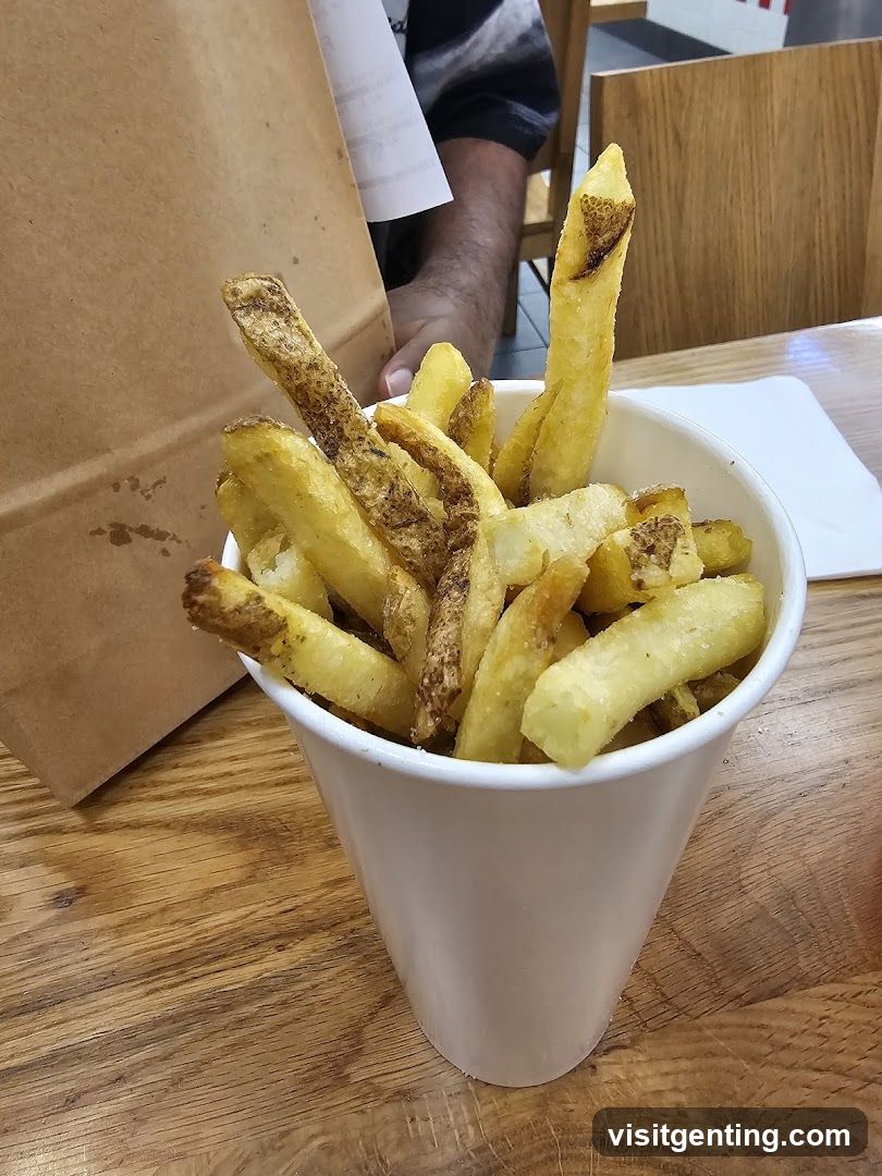 Fries in a cup on wooden table