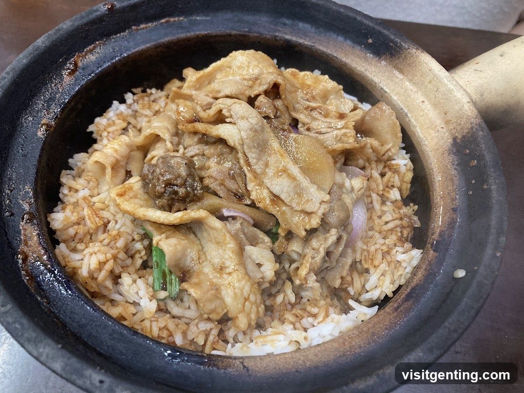 Stir-fried rice with meat in clay pot