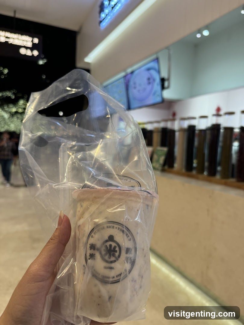 Hand holding packaged drink in store interior