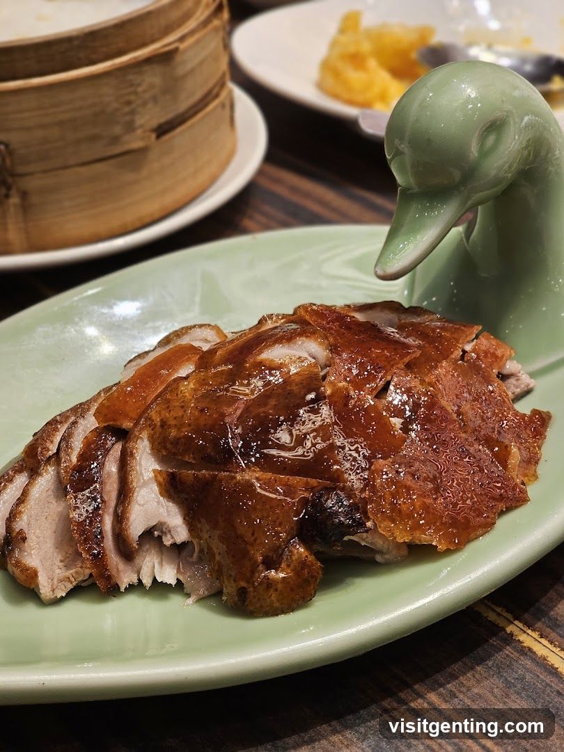 Duck dish served on green plate with duck-shaped ceramic holder