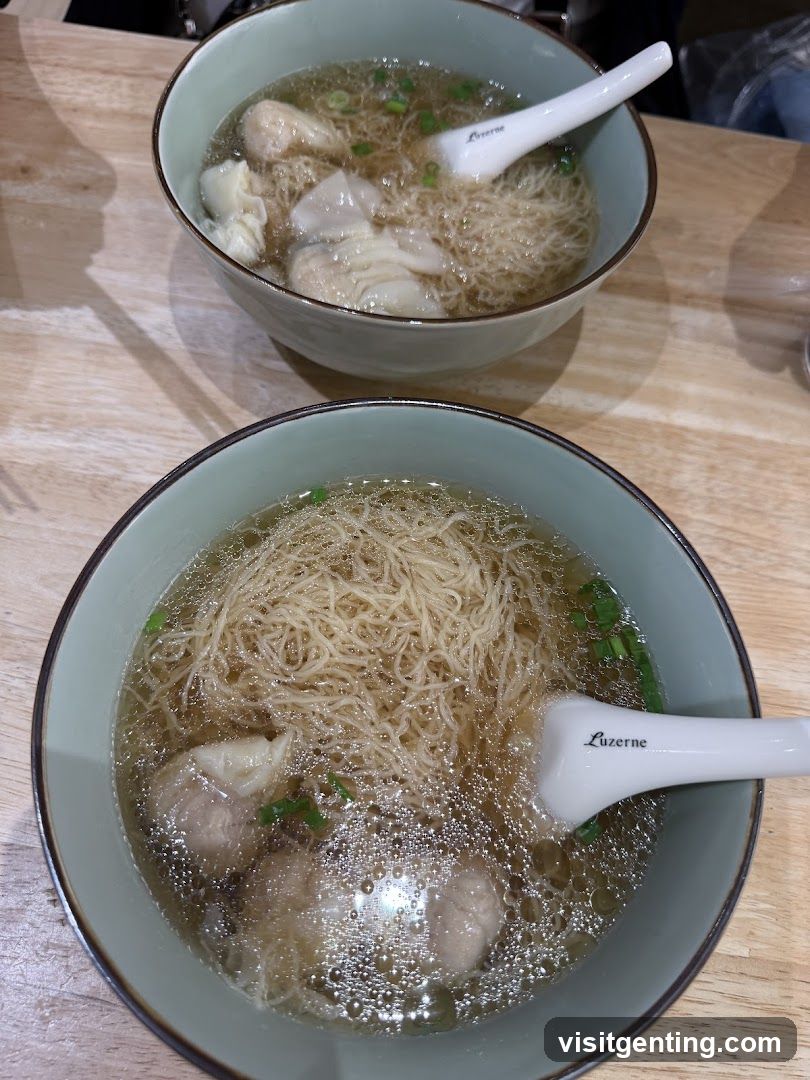 Two bowls of wonton noodle soup